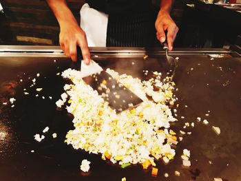 Midsection of man preparing food