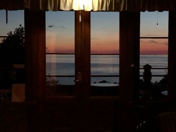 Scenic view of sea seen through window