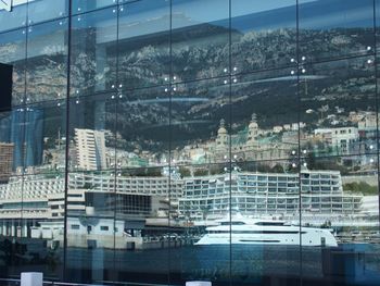 Reflection of cityscape on mountain