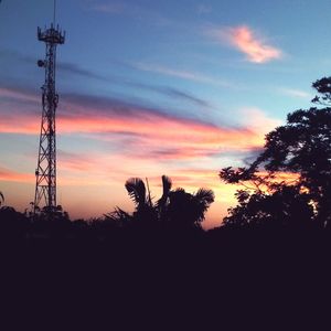 Low angle view of silhouette trees against sky during sunset