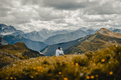 Scenic view of mountains against cloudy sky