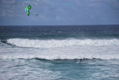 Person parasailing in the waves