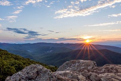 Scenic view of mountains against sky during sunset