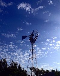 Low angle view of wind turbine against sky