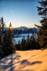 Scenic view of snow covered landscape against sky