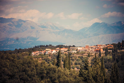 Scenic view of mountains against cloudy sky