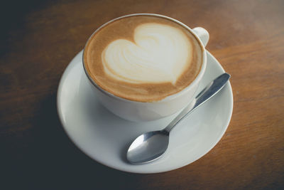 High angle view of cappuccino on table