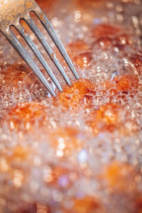 Close-up of water drops on table