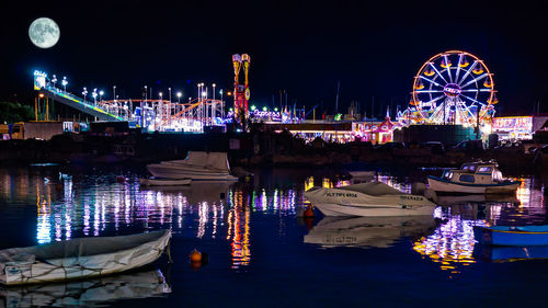 View of illuminated ferris wheel at night