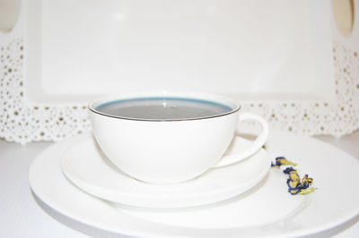 Close-up of coffee cup on table