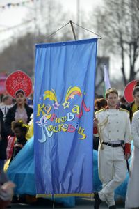 People standing against multi colored umbrella in city