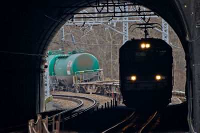 Train in illuminated tunnel