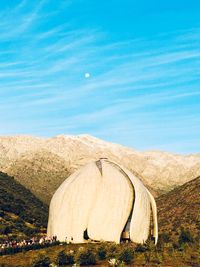 Tent on land against blue sky