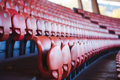 Rows of red seats in sports stadium