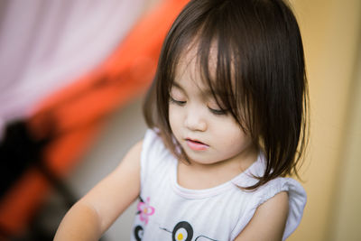 Close-up of cute girl at home