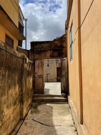 Empty alley amidst buildings in city