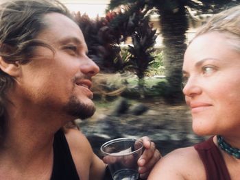 Portrait of young man drinking glass