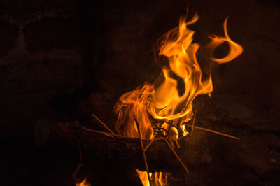 Close-up of fire burning at night