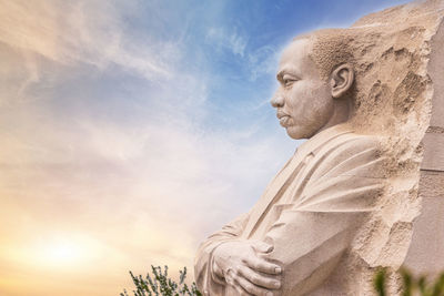 Low angle view of statue against sky