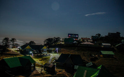 High angle view of buildings at night