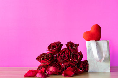 Close-up of red rose on table