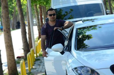 Young man in car on road