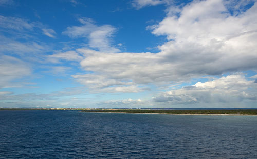 Scenic view of landscape against blue sky