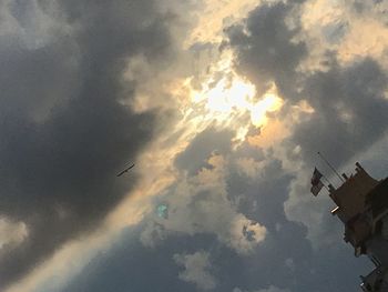 Low angle view of airplane flying in sky