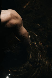 Low section of woman in water