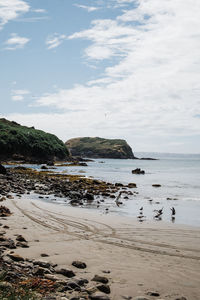 Scenic view of beach against sky