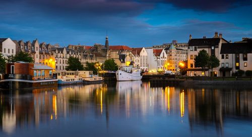 Reflection of illuminated buildings in water