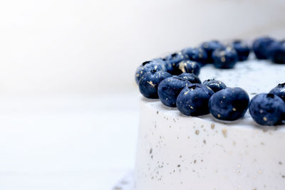 Close-up of blueberries against white background