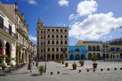 Buildings in city against sky