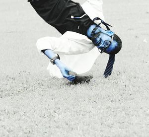 Low section of man skateboarding