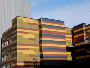 Low angle view of modern buildings against sky in city