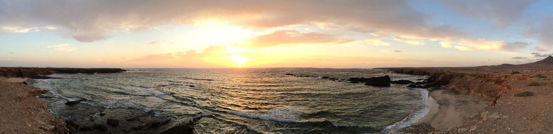 Scenic view of sea at sunset