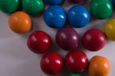 High angle view of multi colored candies on table