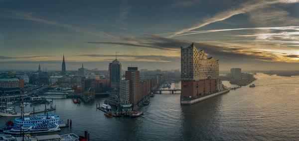 The elbphilharmonie at sunrise in the harbour of hambrug