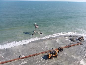 High angle view of people on sea against sky