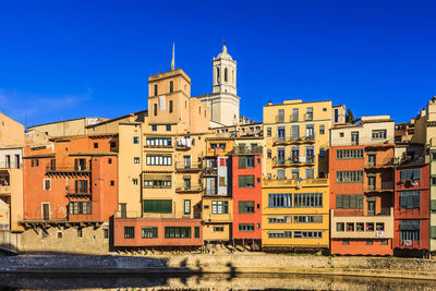 View of buildings against blue sky