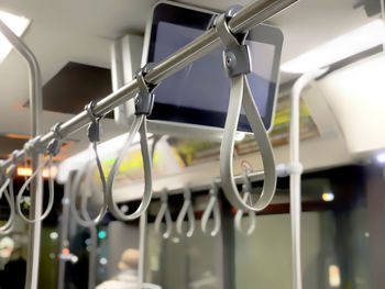 A row of gray bus handles. public transport. empty bus in the evening