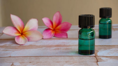 Close-up of green bottle on table