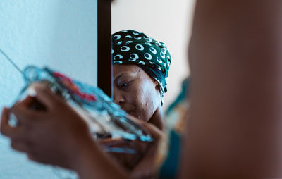 Woman holding radio at home