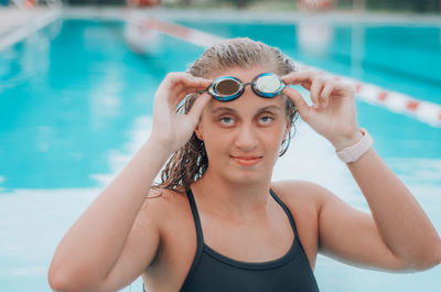 Portrait of woman swimming in pool