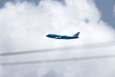 Low angle view of airplane against sky