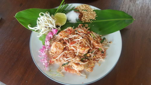 High angle view of chopped vegetables in plate on table