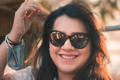 Portrait of young woman wearing sunglasses