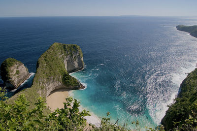 High angle view of rocks in sea against sky