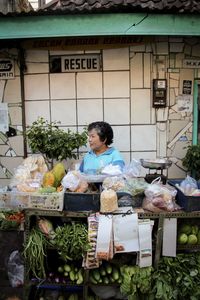 Woman selling vegetables in market