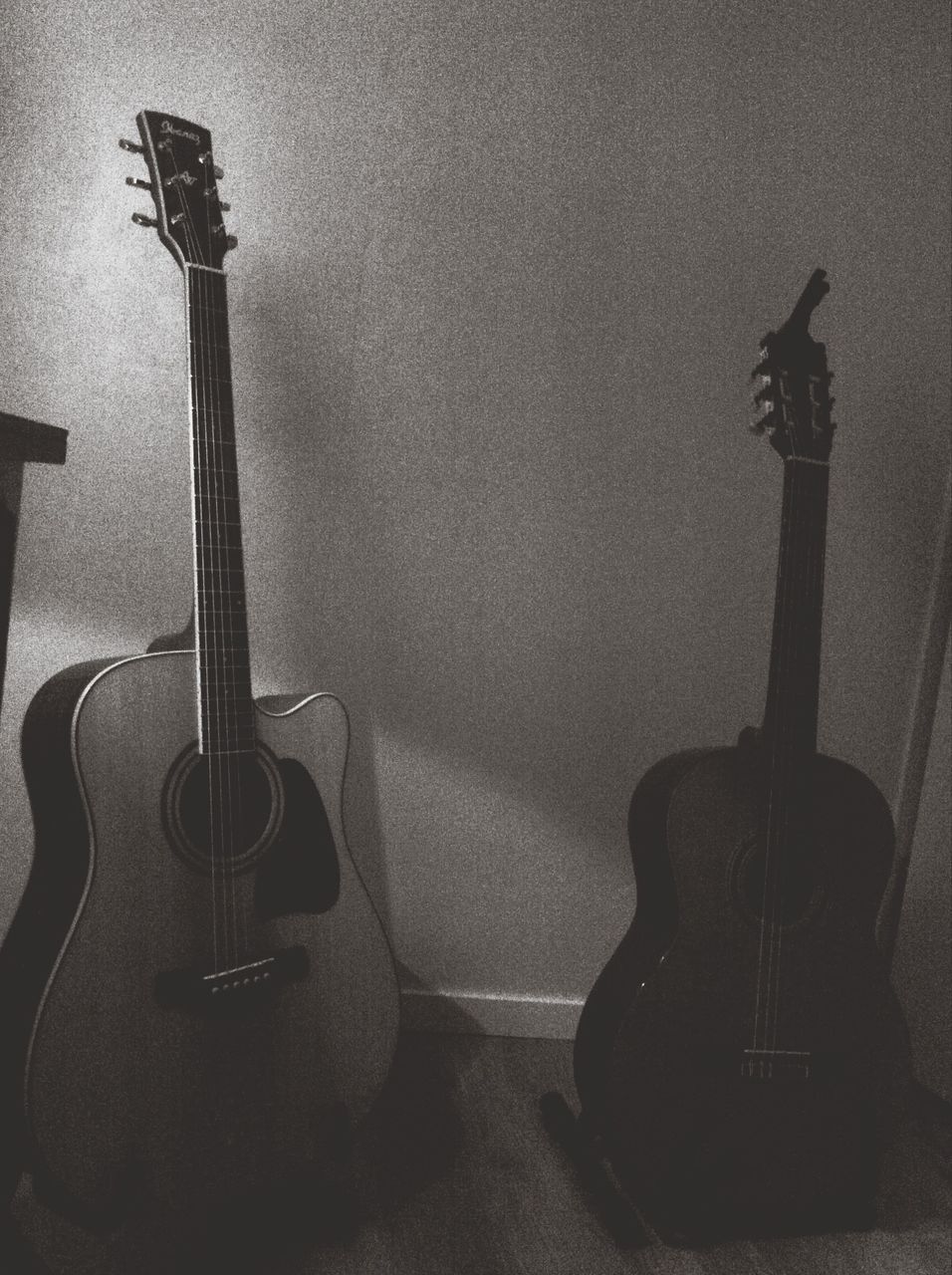 indoors, wall - building feature, musical instrument, high angle view, home interior, shadow, built structure, still life, no people, music, architecture, close-up, guitar, technology, wall, metal, equipment, part of, table, copy space